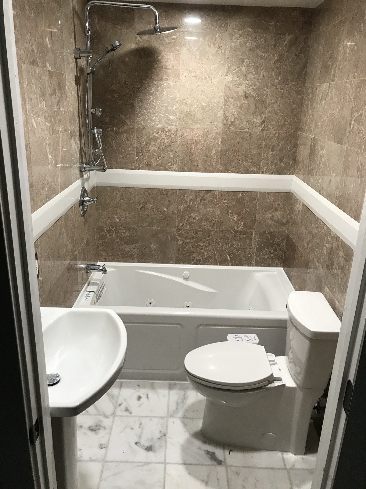 Bathroom with tub, shower, toilet and basin